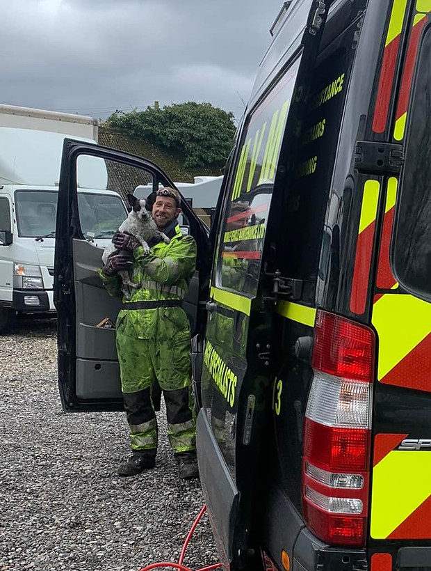 MVM technician next to service van